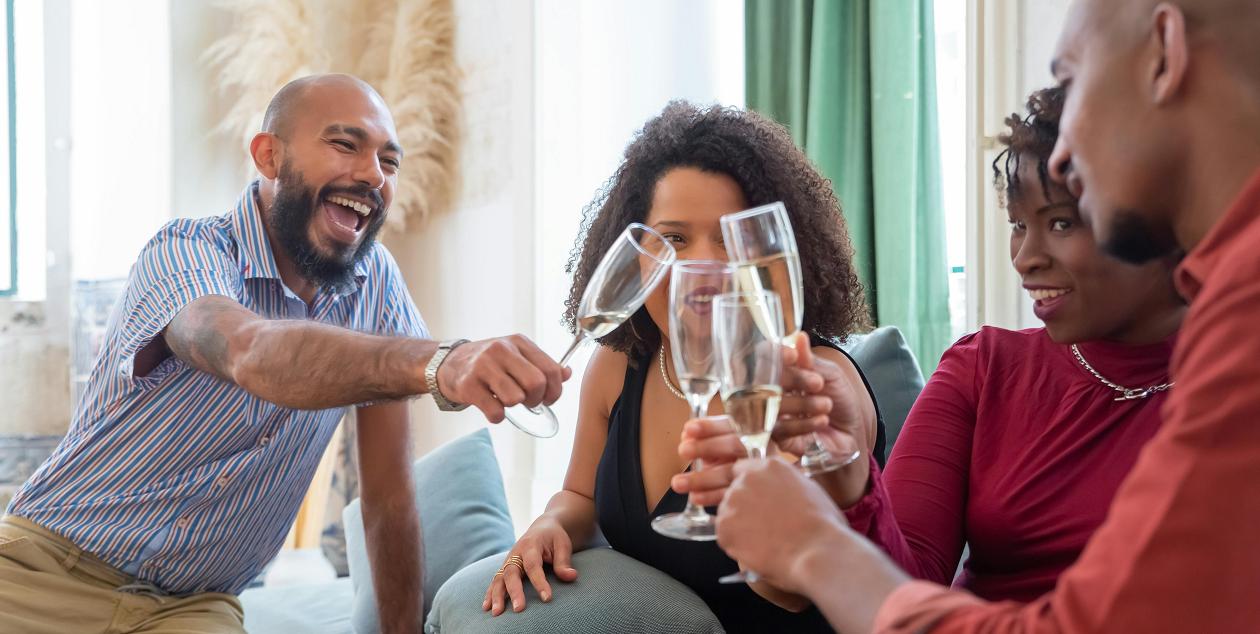 A group of friends happily sharing a toast