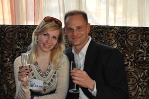 A photo of a couple holding wine glasses